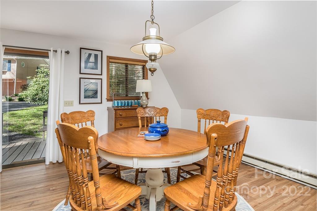 20 Lady Slipper Loop Newland, NC 28657 - Photo 19 of 44 a view of a dining room with furniture window and wooden floor