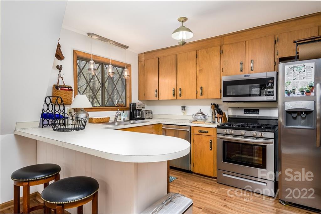 20 Lady Slipper Loop Newland, NC 28657 - Photo 20 of 44 a kitchen with stainless steel appliances a stove a sink and a microwave