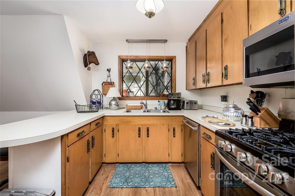 20 Lady Slipper Loop Newland, NC 28657 - Photo 21 of 44 a kitchen with a sink stove top oven and cabinets