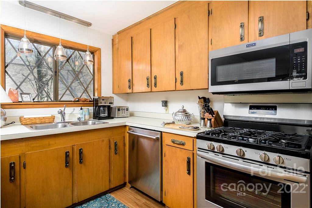 20 Lady Slipper Loop Newland, NC 28657 - Photo 22 of 44 a kitchen with stainless steel appliances a sink a stove and a microwave