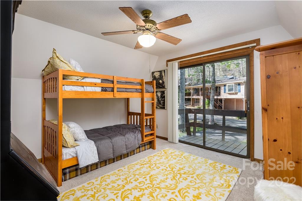 20 Lady Slipper Loop Newland, NC 28657 - Photo 28 of 44 a bedroom with bed and glass door