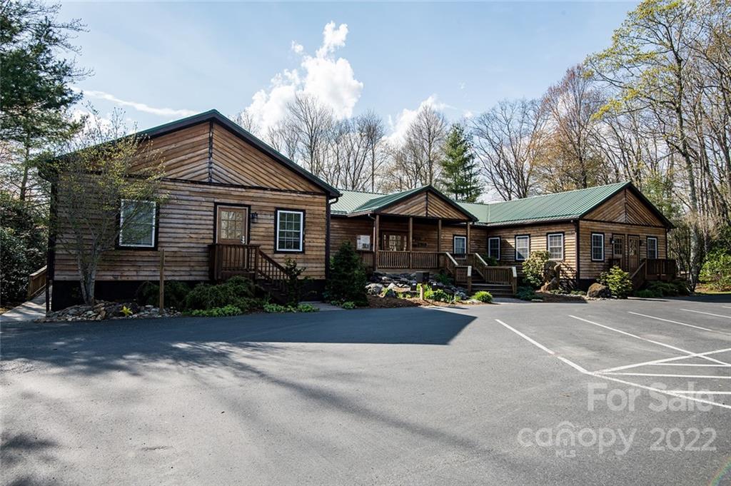 20 Lady Slipper Loop Newland, NC 28657 - Photo 35 of 44 a front view of a house with yard and parking