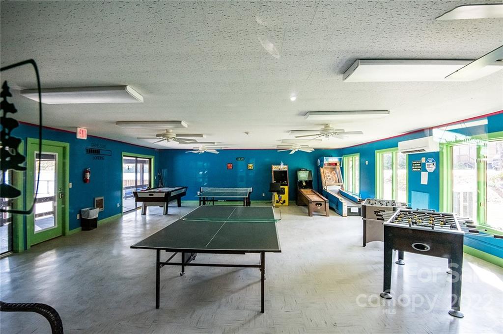 20 Lady Slipper Loop Newland, NC 28657 - Photo 36 of 44 a living room with furniture a pool table and a large window