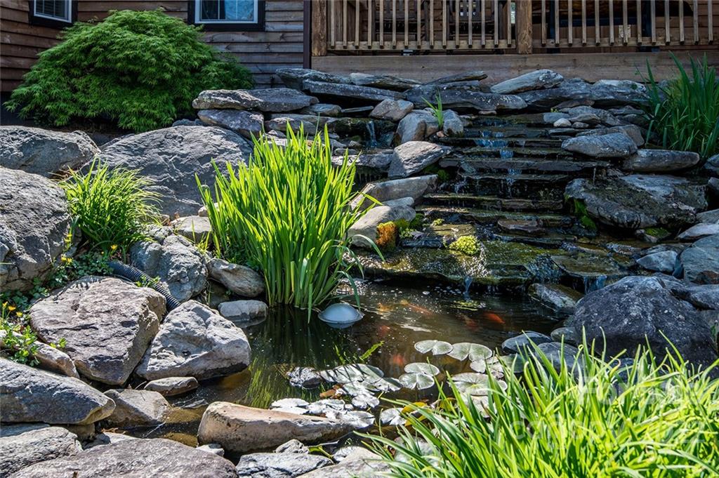 20 Lady Slipper Loop Newland, NC 28657 - Photo 37 of 44 a backyard of a house with a yard with outdoor seating