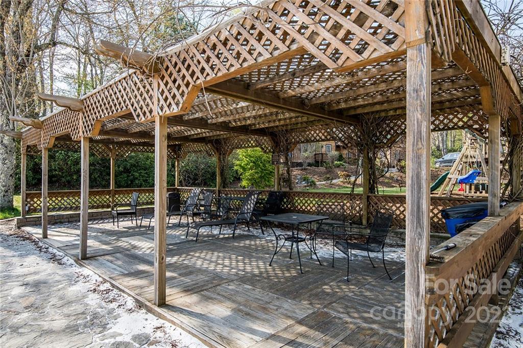 20 Lady Slipper Loop Newland, NC 28657 - Photo 39 of 44 a view of a patio with a table and chairs