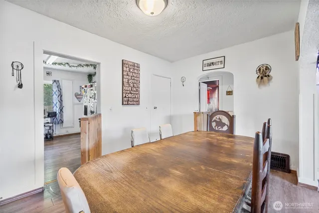 a bedroom with a bed and a table