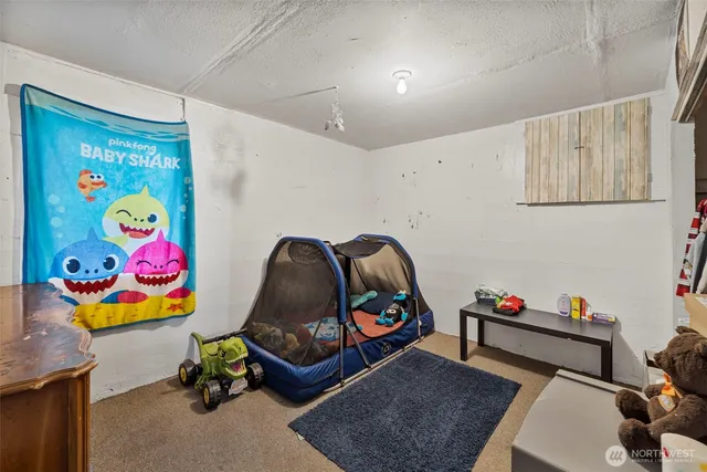 a bedroom with a bed and toys