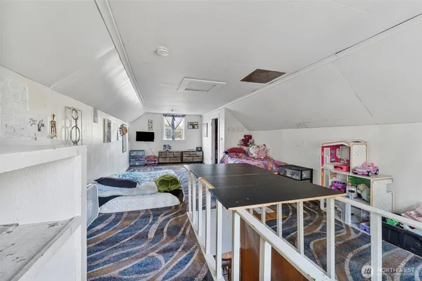 a view of a livingroom with furniture a ceiling fan and wooden floor