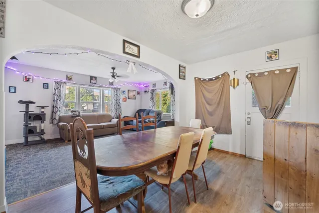 a dining room with furniture and window