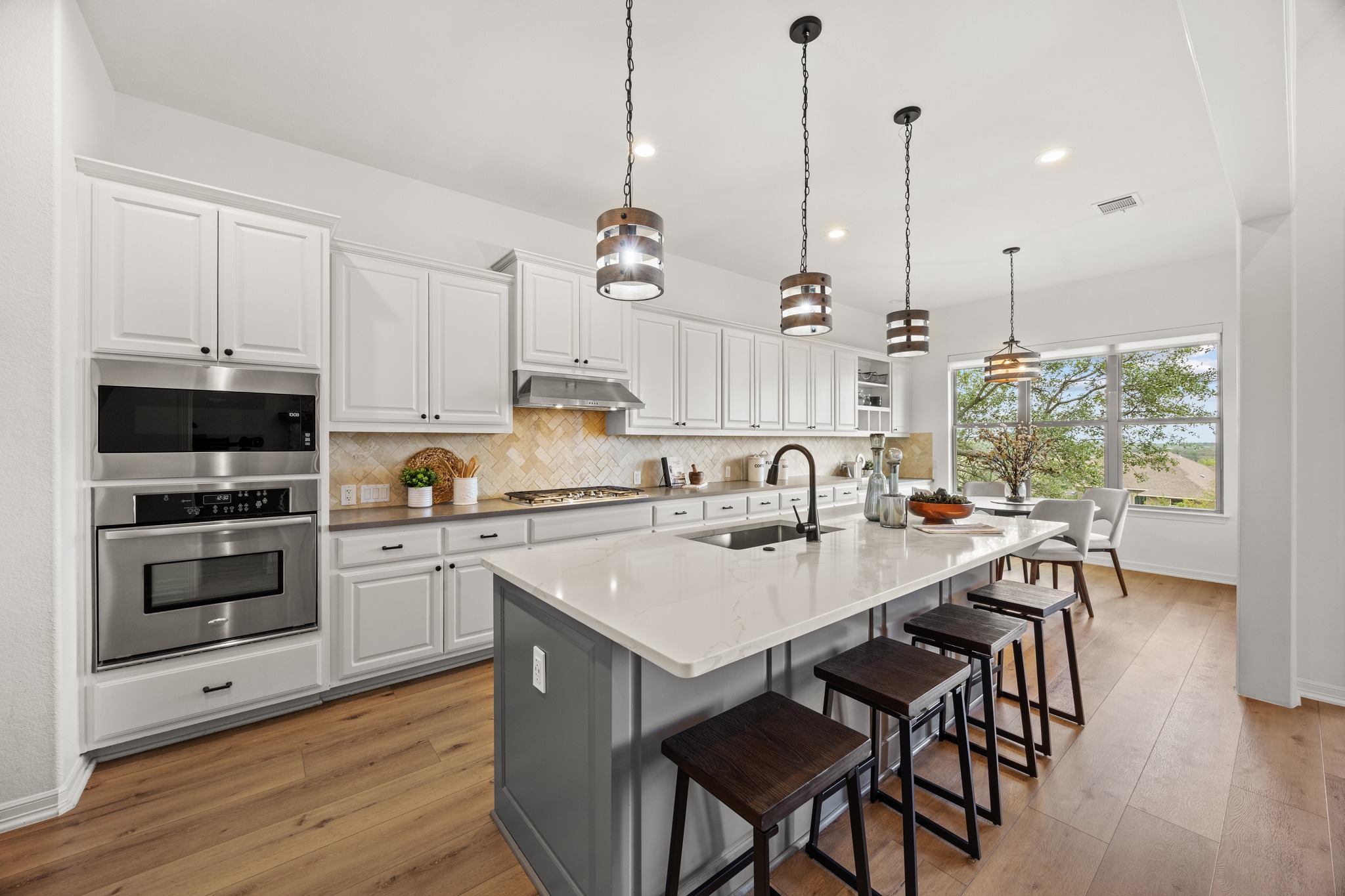 366 Mirafield Lane Austin, TX 78737 - Photo 18 of 34 Open and functional kitchen with island and morning room
