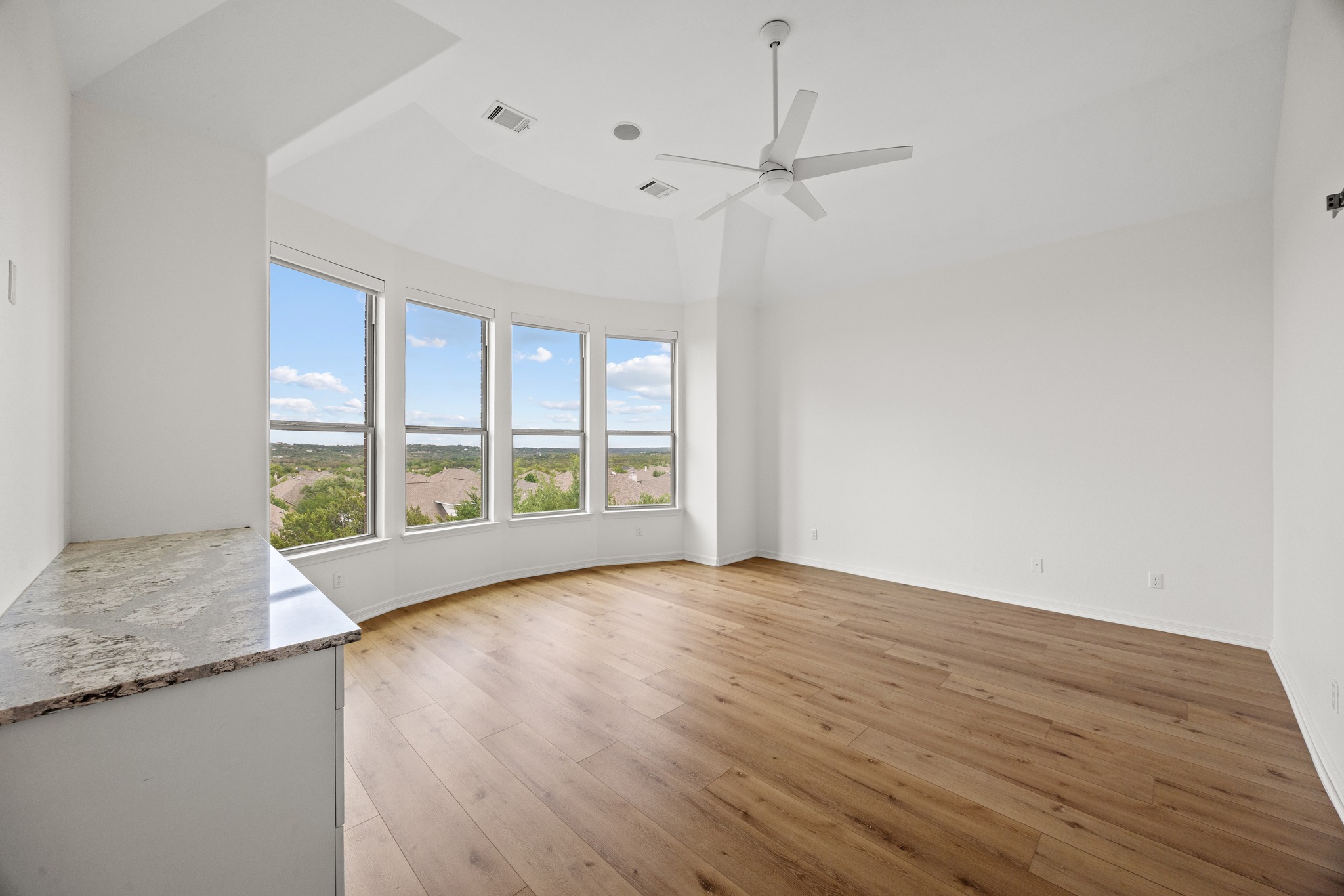 366 Mirafield Lane Austin, TX 78737 - Photo 22 of 34 Spacious primary bedroom with panoramic hill country views