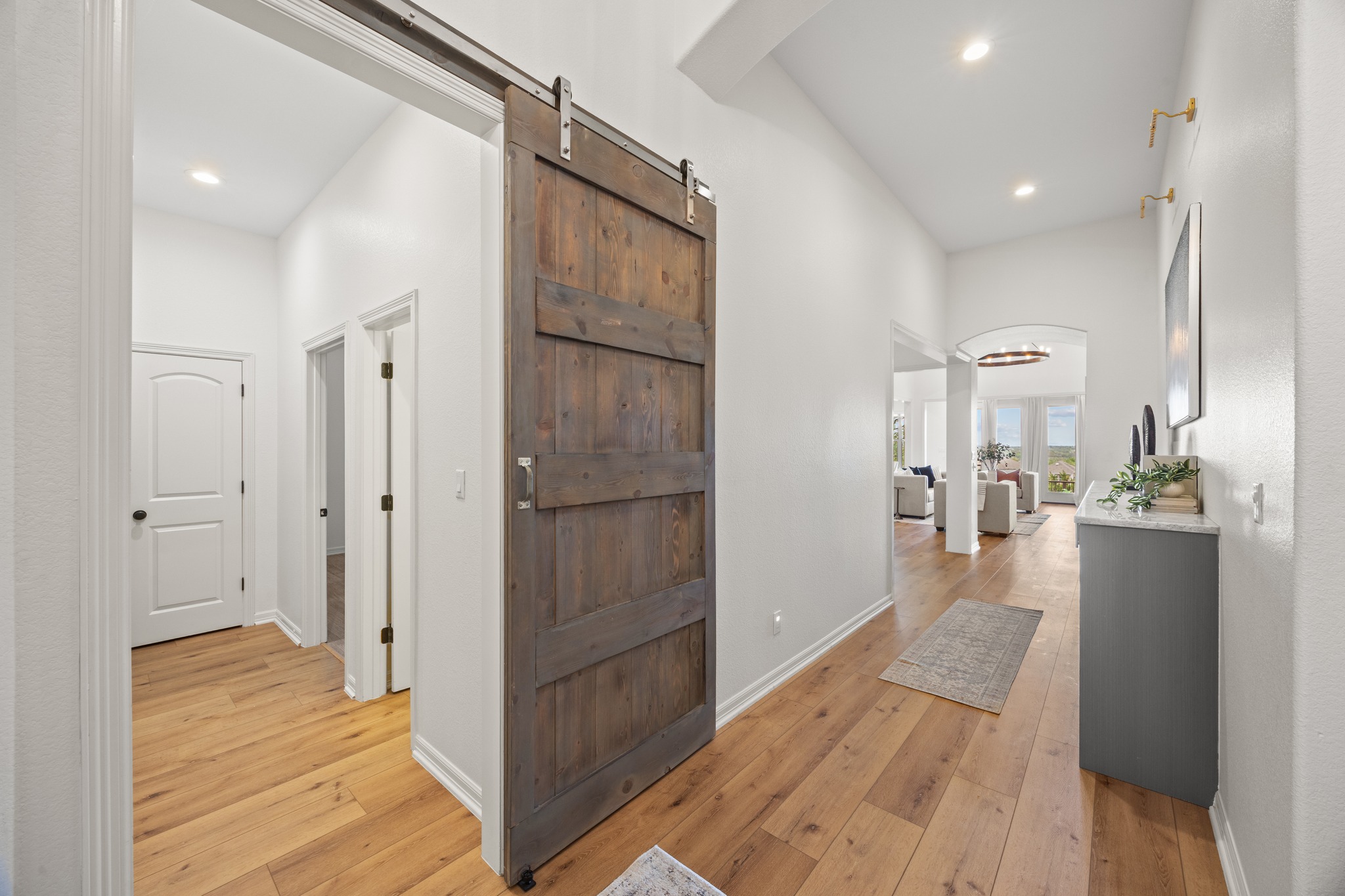 366 Mirafield Lane Austin, TX 78737 - Photo 5 of 34 View from foyer of guest corridor and main hall leading to living areas with premium built-in cabinetry.