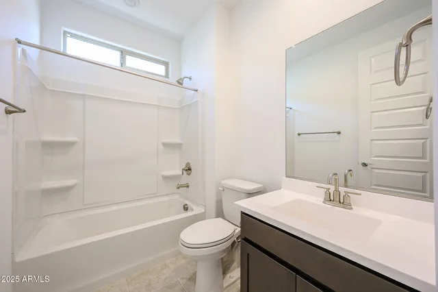 a bathroom with a sink a toilet and a bathtub