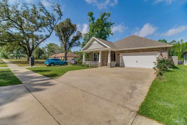a house with yard in front of it