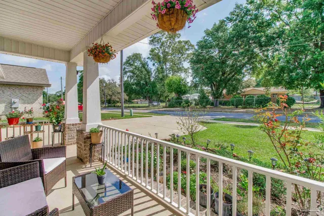 a view of swimming pool with sitting area