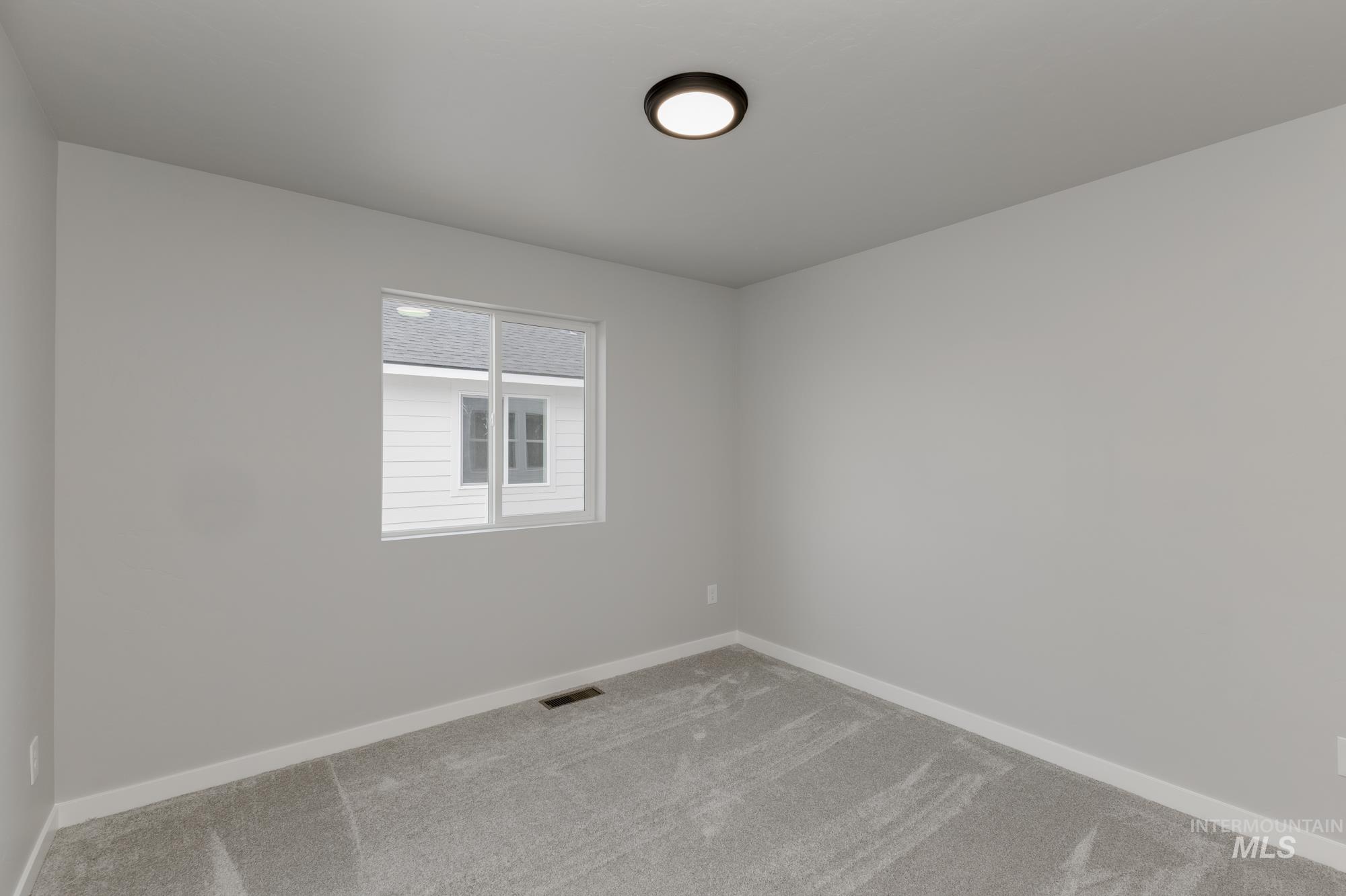 3672 West Dover Drive Meridian, ID 83642 - Photo 12 of 23 Carpeted empty room with baseboards