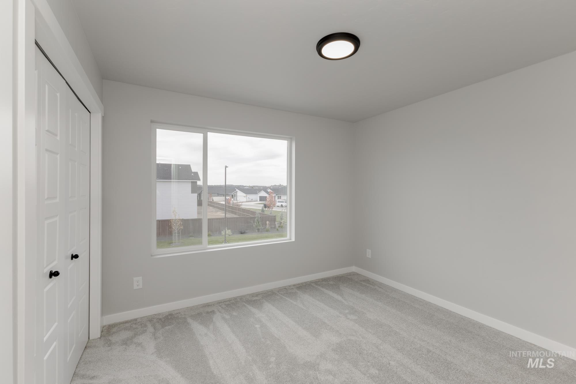 3672 West Dover Drive Meridian, ID 83642 - Photo 14 of 23 Unfurnished bedroom with light colored carpet and a closet