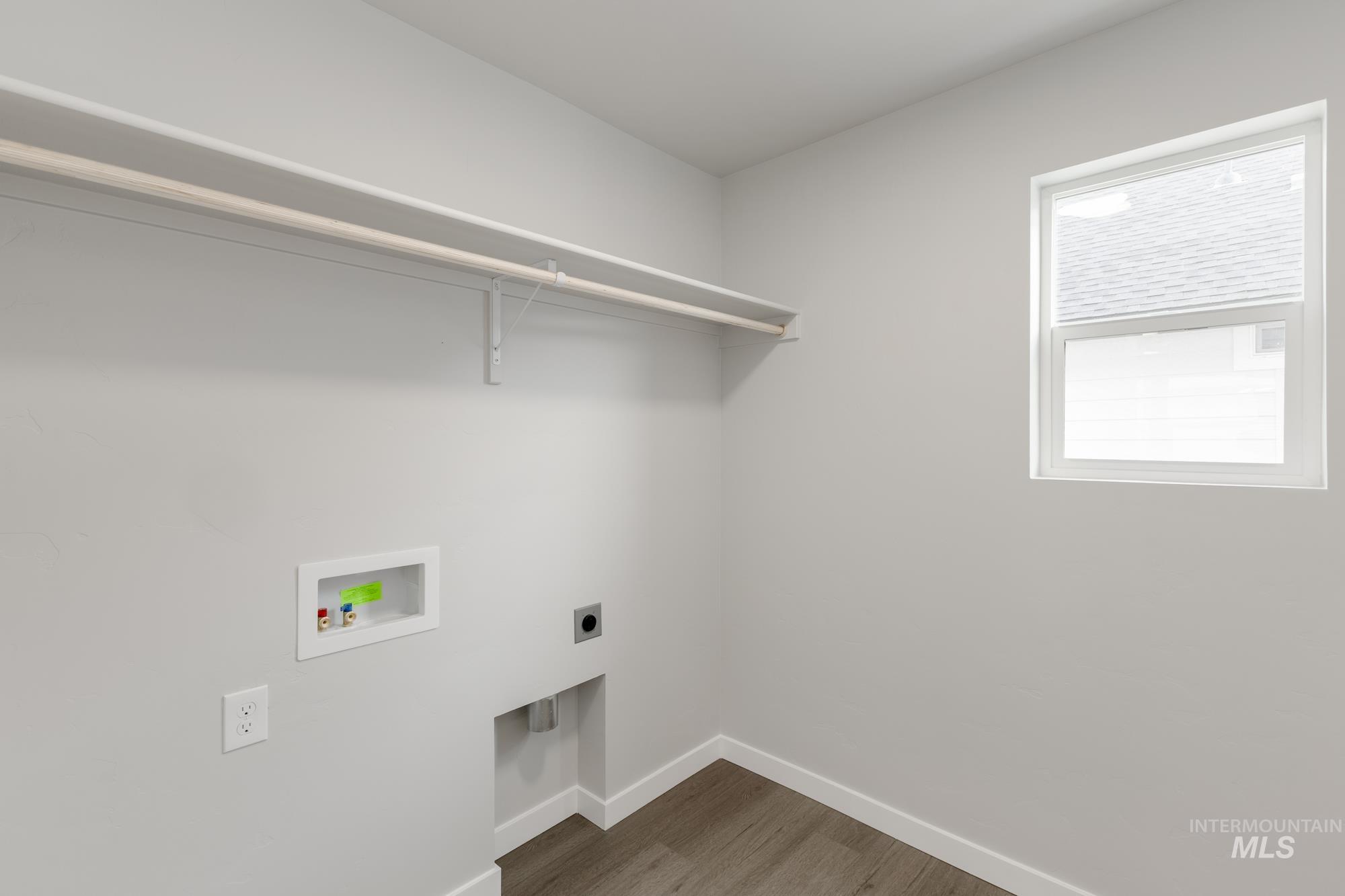 3672 West Dover Drive Meridian, ID 83642 - Photo 17 of 23 Laundry room featuring hookup for an electric dryer, dark wood finished floors, and washer hookup