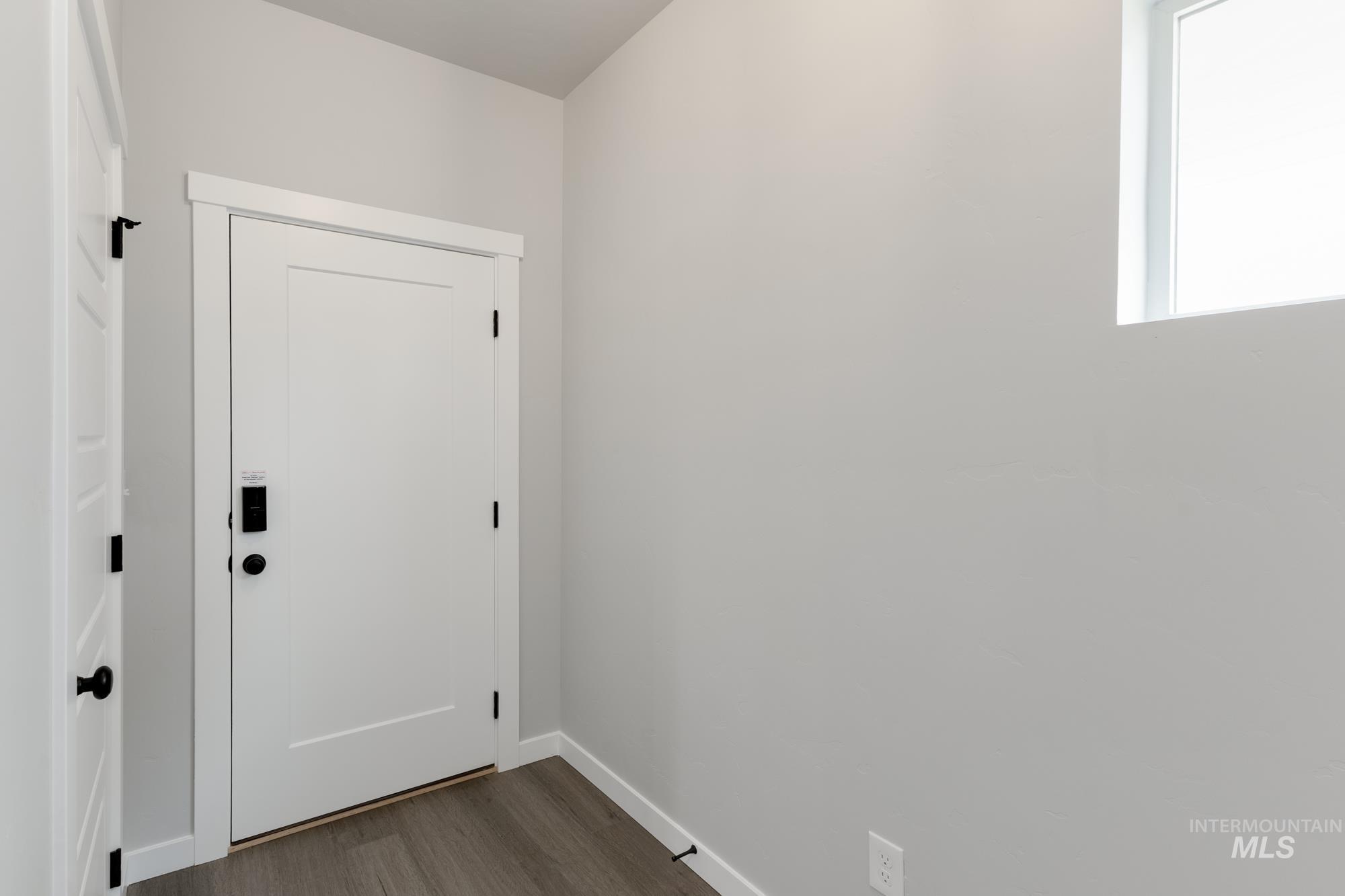 3672 West Dover Drive Meridian, ID 83642 - Photo 2 of 23 Entryway with wood finished floors and baseboards