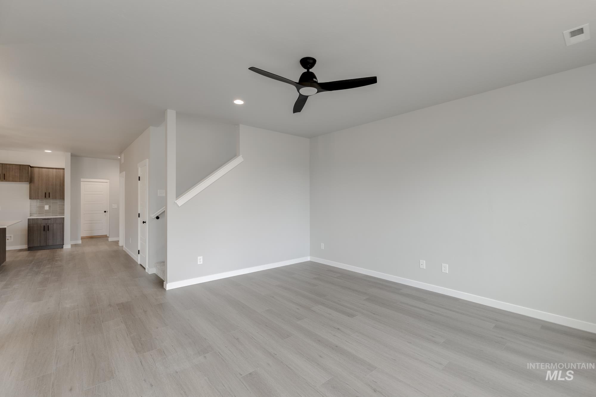 3672 West Dover Drive Meridian, ID 83642 - Photo 8 of 23 Unfurnished living room featuring light wood-style flooring, recessed lighting, and ceiling fan