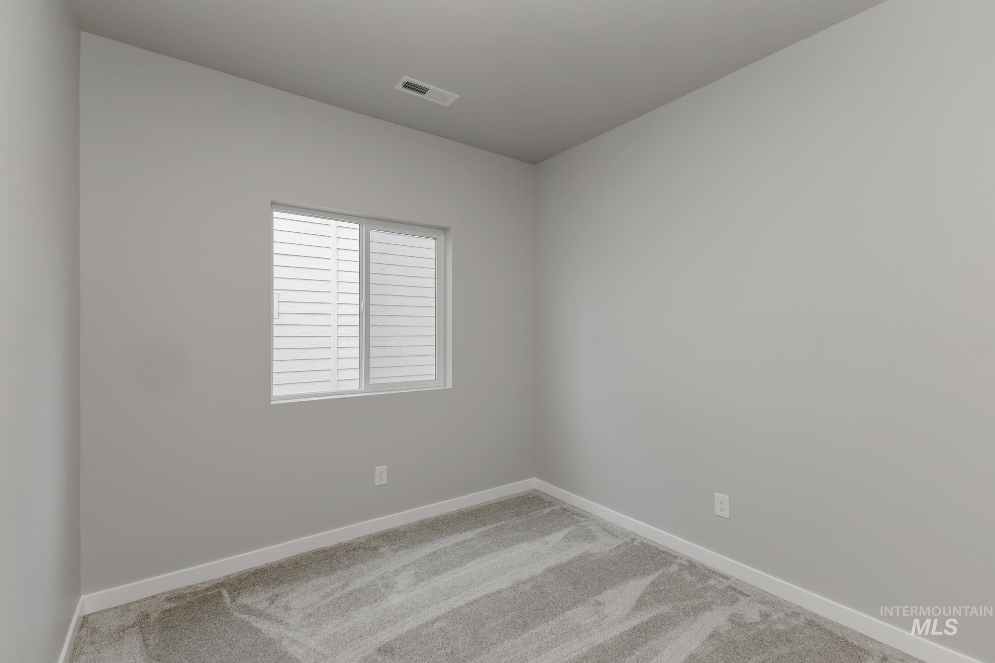 3672 West Dover Drive Meridian, ID 83642 - Photo 9 of 23 Carpeted spare room featuring baseboards