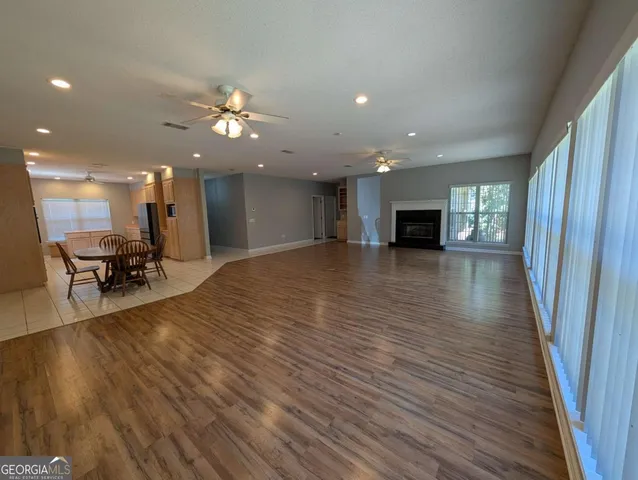 a view of a kitchen with a sink and a fireplace