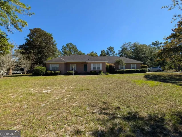 a view of a house with swimming pool and porch with furniture