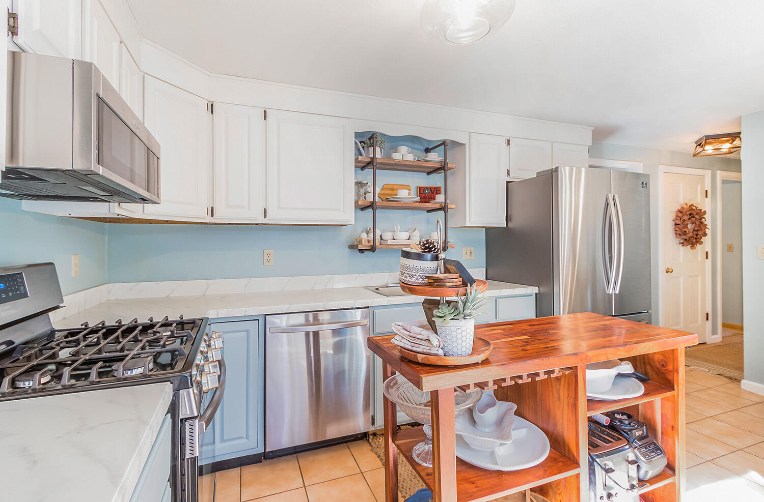 3 Nickerson Road Harwich, MA 02645 - Photo 13 of 23 a kitchen with stainless steel appliances a dining table and chairs