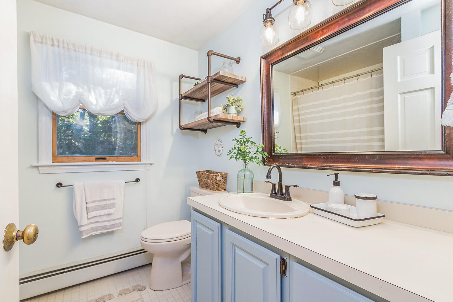 3 Nickerson Road Harwich, MA 02645 - Photo 15 of 23 a bathroom with a toilet a sink and mirror