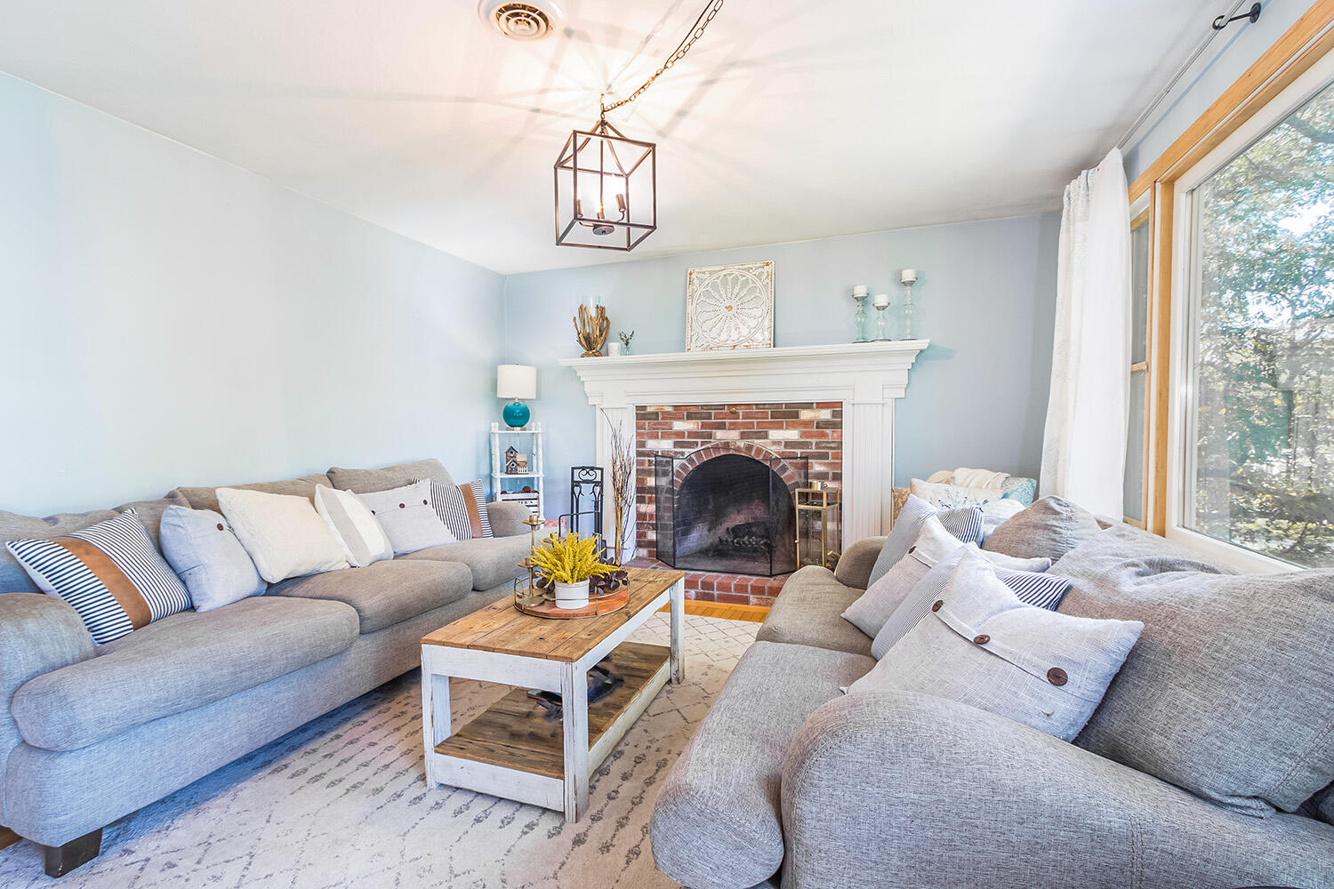 3 Nickerson Road Harwich, MA 02645 - Photo 10 of 23 a living room with furniture a fireplace and a large window