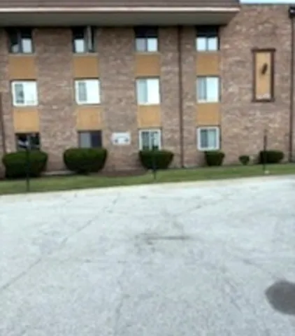 a view of a building with a yard