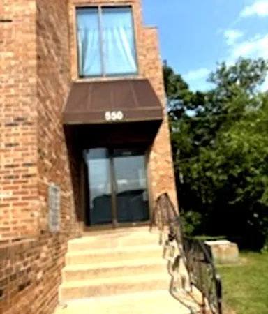 a view of house with backyard