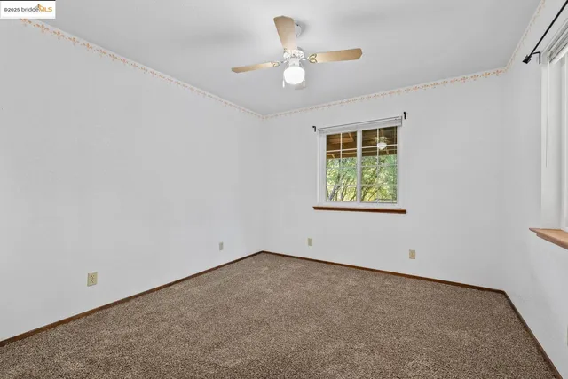 a view of an empty room and window