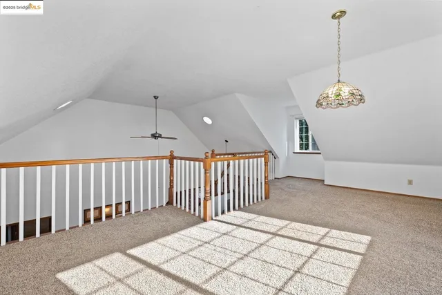 a bathroom with a granite countertop sink toilet and mirror