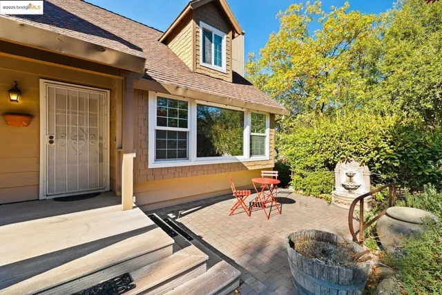 a view of balcony with wooden floor and outdoor seating