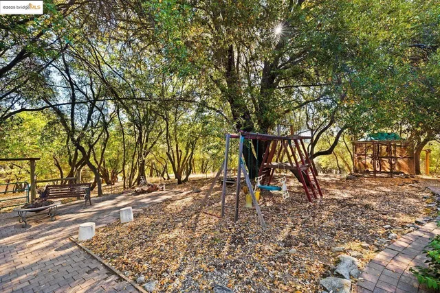 a view of a bench in a backyard
