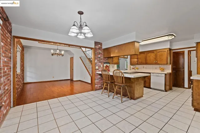 a view of a kitchen and dining room