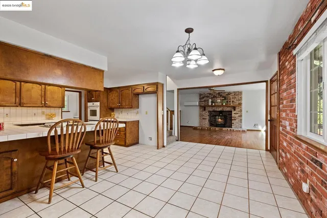 a view of a livingroom with furniture window and wooden floor