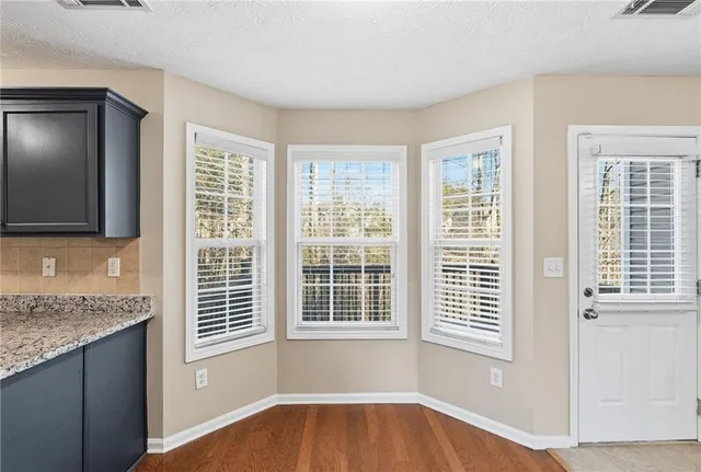 a view of a kitchen that has a sink and a dishwasher in it