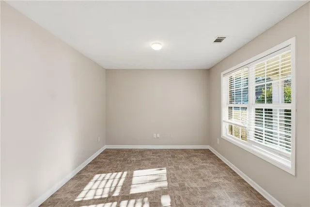 a view of an empty room and window