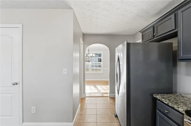 a view of a hallway to rooms