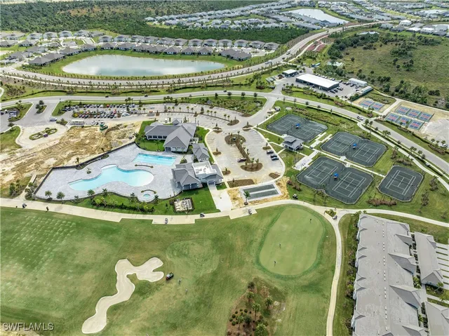 a view of swimming pool with a lawn chairs