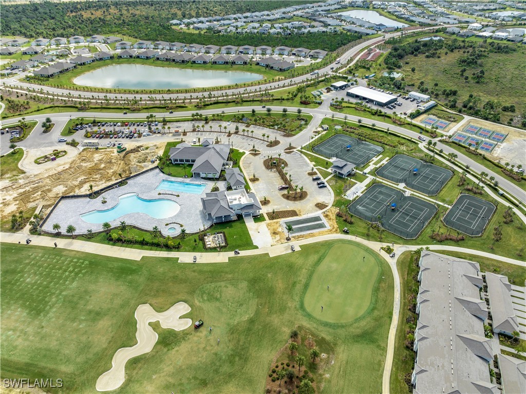 43989 Boardwalk Loop, Unit 2018 Coffeyville, KS 67337 - Photo 19 of 29 a view of swimming pool with a garden and seating area