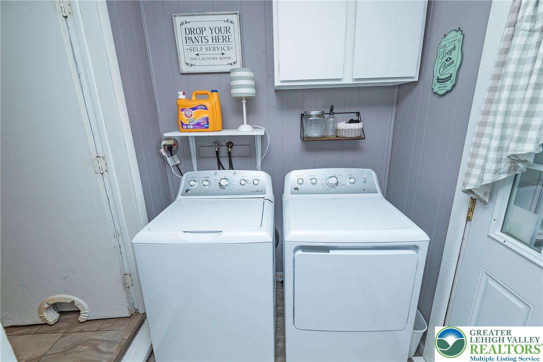 1114 Fox Gap Road Bangor, PA 18013 - Photo 30 of 63 Functional cabinetry and wood-look flooring enhance this dedicated laundry setup.