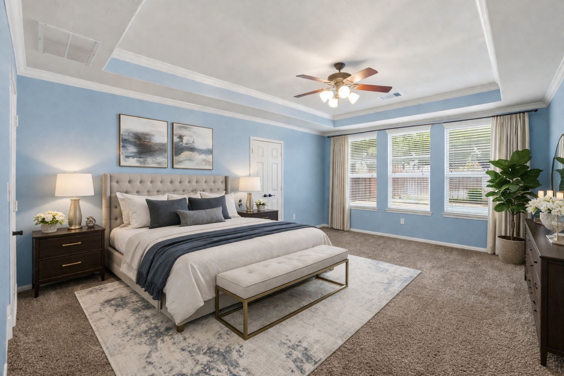 8169 Tranquil Lake Way Conroe, TX 77385 - Photo 14 of 26 a spacious bedroom with a large bed and a chandelier fan