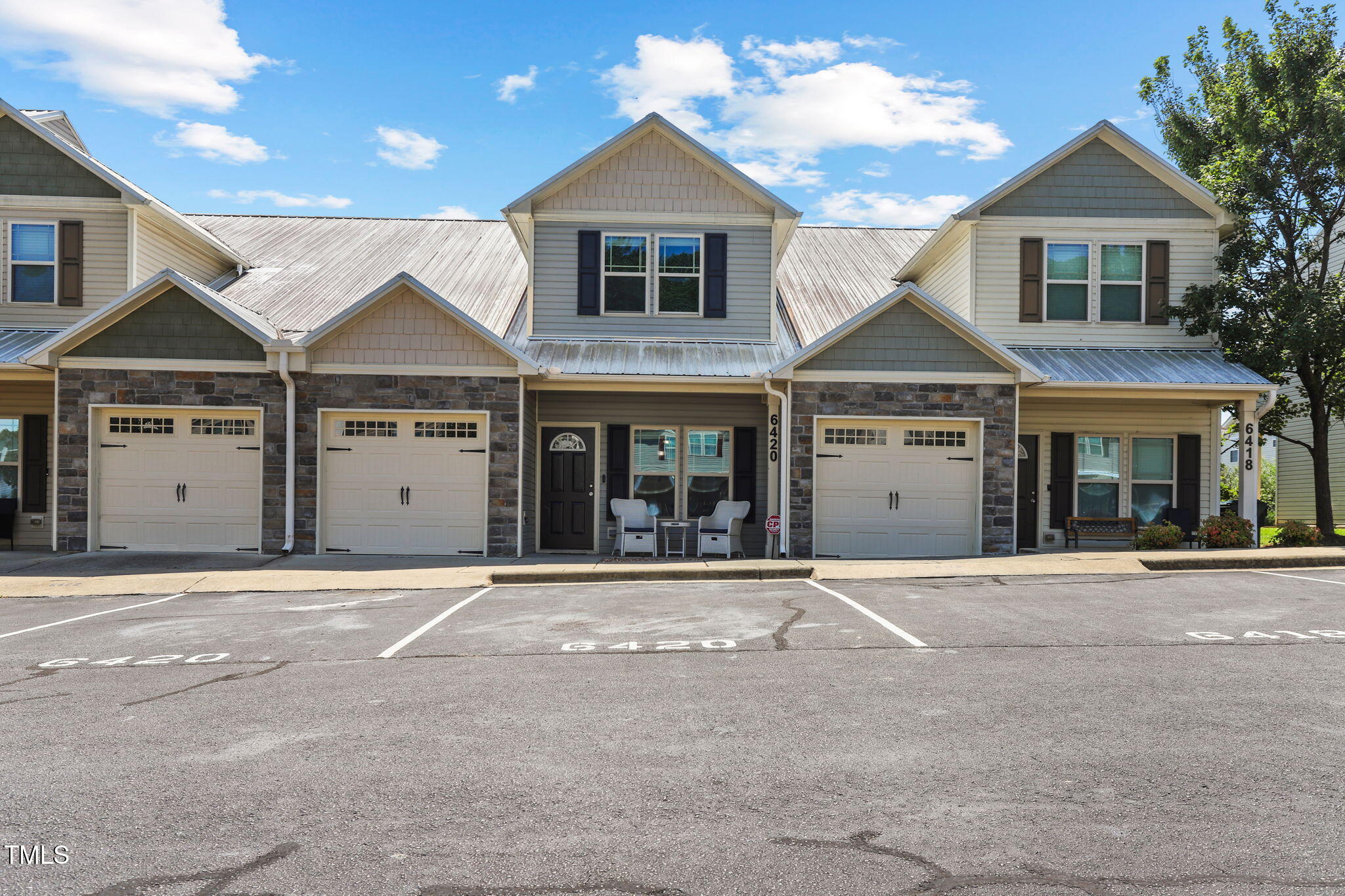 6420 Hatchies Drive Raleigh, NC 27610 - Photo 1 of 24 a front view of a house with a yard and garage