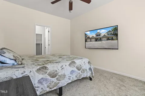 a bedroom with a bed and hallway