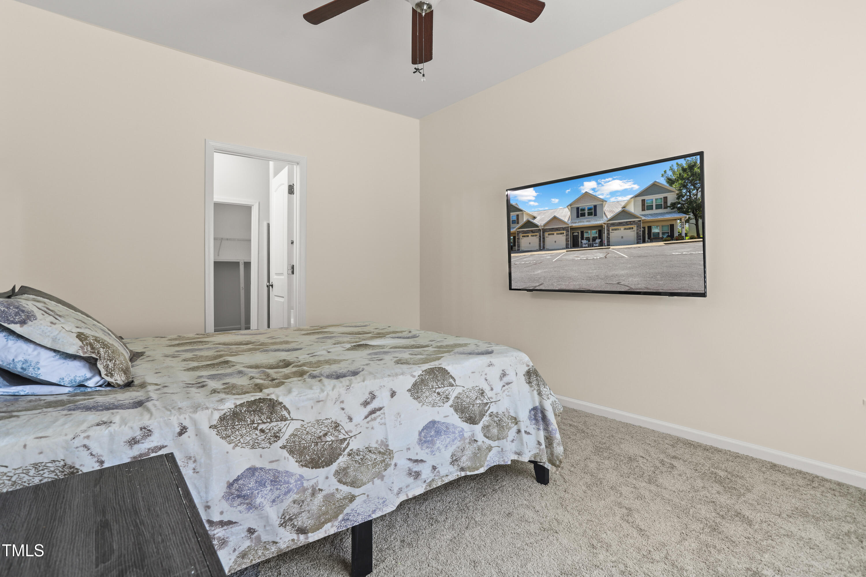 6420 Hatchies Drive Raleigh, NC 27610 - Photo 11 of 24 a bedroom with a bed and hallway