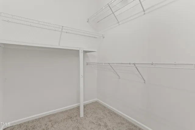 a view of a room with racks on the wall