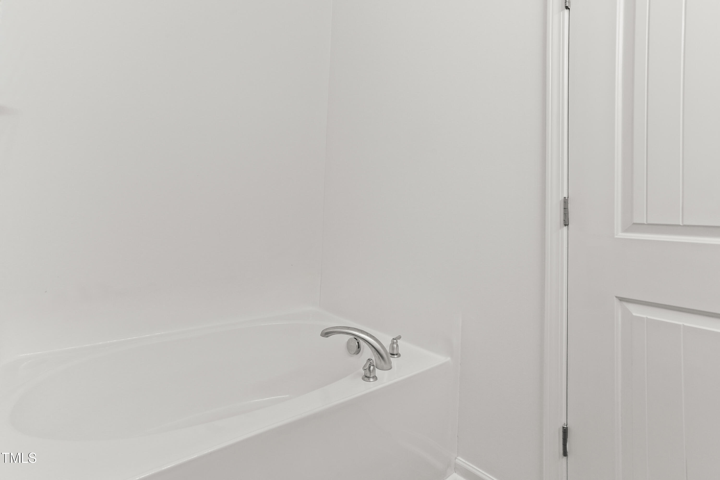 6420 Hatchies Drive Raleigh, NC 27610 - Photo 17 of 24 a bathroom with a bathtub